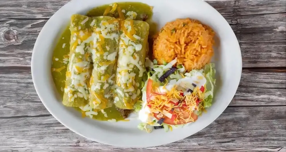 Enchiladas verdes with rice and salad